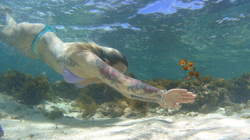 Woman swimming in sea