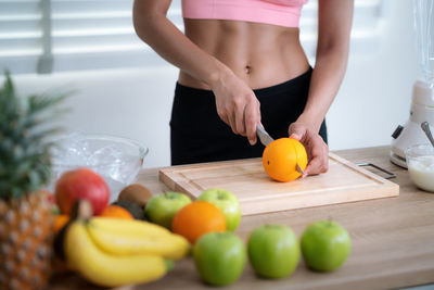 Midsection of woman preparing food