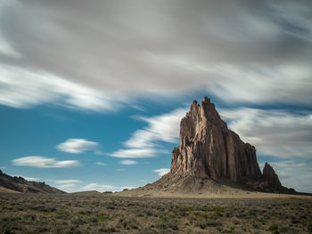 Rock formations on landscape against sky