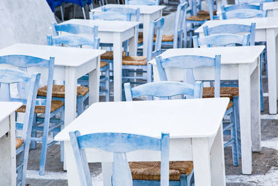 Empty chairs and tables in cafe 