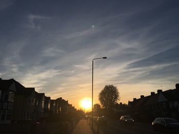 View of city street at sunset