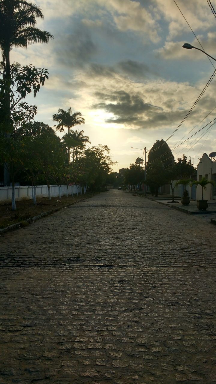 FOOTPATH BY ROAD AGAINST SKY