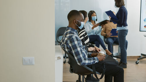 Side view of business colleagues working at home