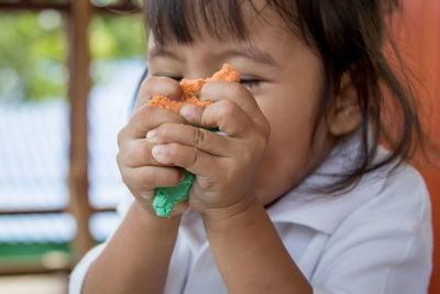 Close-up of girl playing at home