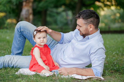 Middle age caucasian proud father playing with baby daughter. family dad and daughter  together 