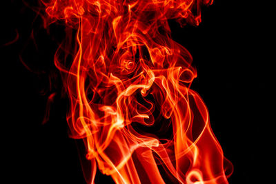 Close-up of fire against black background