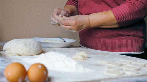 Midsection of woman preparing food