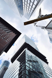 Low angle view of modern buildings against sky