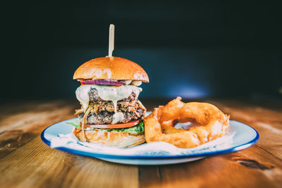 Close-up of burger in plate on table