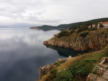 Scenic view of sea against cloudy sky