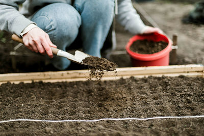 Midsection of man working at farm