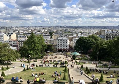 High angle view of people and paris skyline  