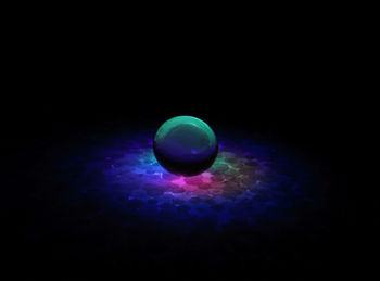 Close-up of light painting against black background