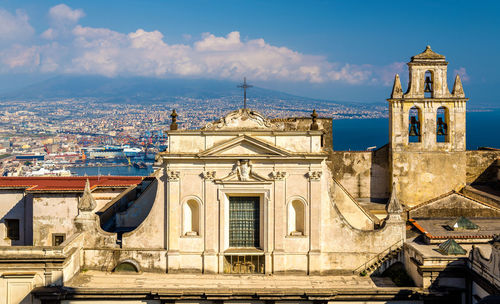 Buildings in city against sky