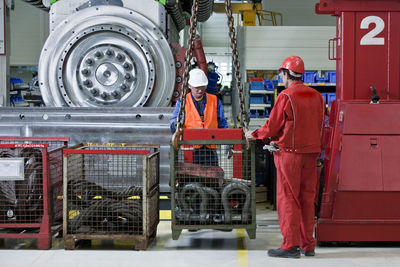 Industry, workers and indoor crane