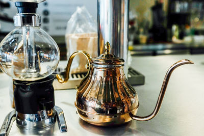 Close-up of coffee served on table at cafe