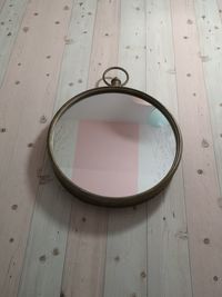 High angle view of mirror on table