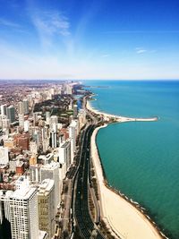 Aerial view of cityscape by sea