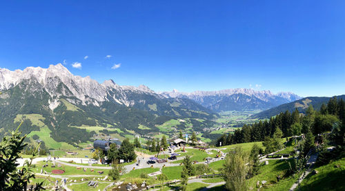 Scenic view of mountains against clear blue sky