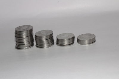 Close-up of stack of objects over white background