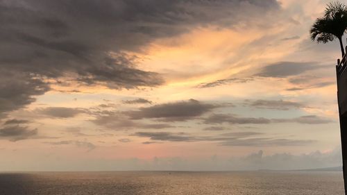 Scenic view of sea against sky at sunset