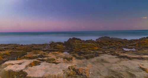 Scenic view of sea at sunset