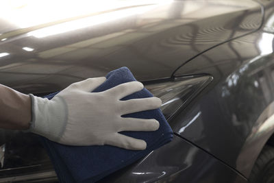 Close-up of hand holding car