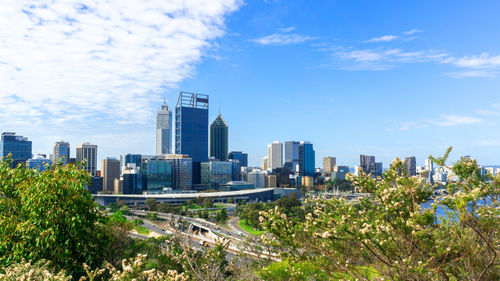 Modern buildings in city against sky