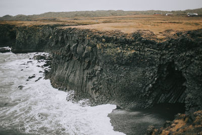 Cliff against sea at beach