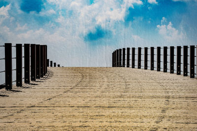 View of road against cloudy sky