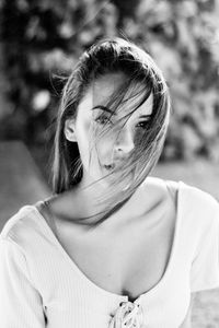 Close-up portrait of young woman standing outdoors