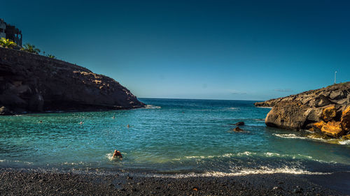 Scenic view of sea against clear blue sky