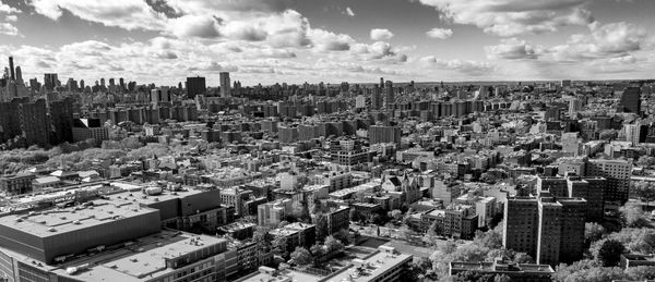 High angle view of city and buildings against sky