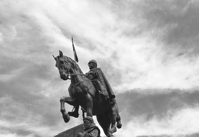 Low angle view of statue against sky