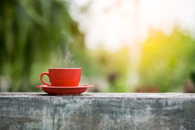 Close-up of coffee cup on wood