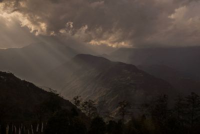 Scenic view of mountains against sky at sunset