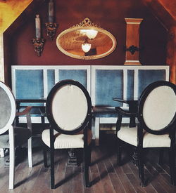 Close-up of empty chairs on table