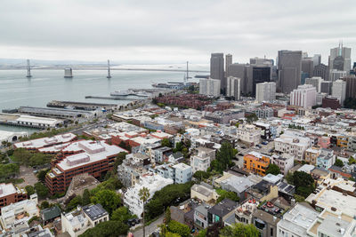 High angle view of buildings in city against sky