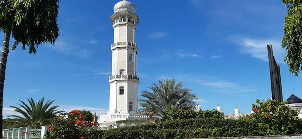 Low angle view of bell tower against sky