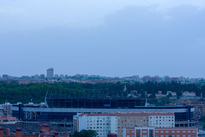 High angle view of buildings in city against sky