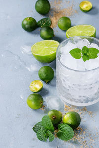 Green fruits on glass