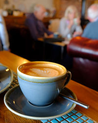 Coffee cup on table at cafe