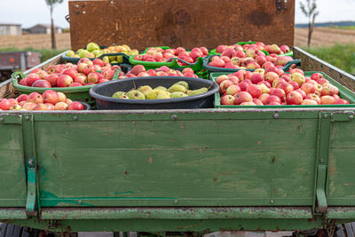 Various fruits in crate at market stall