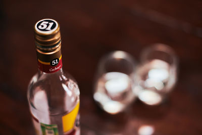 Close-up of beer glass bottle on table