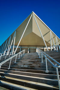 Low angle view of building against clear blue sky