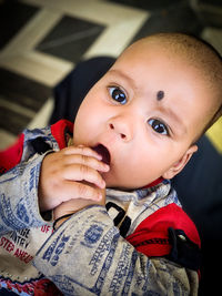 Portrait of cute baby boy at home