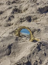High angle view of hole on rock at beach