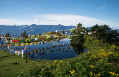 View of prayer flags hanging over lake