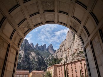 Monastery buildings against mountain rocks