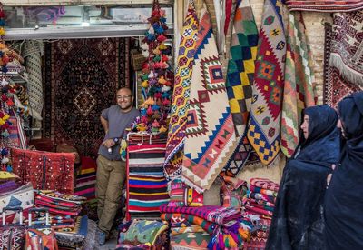 People standing at market stall